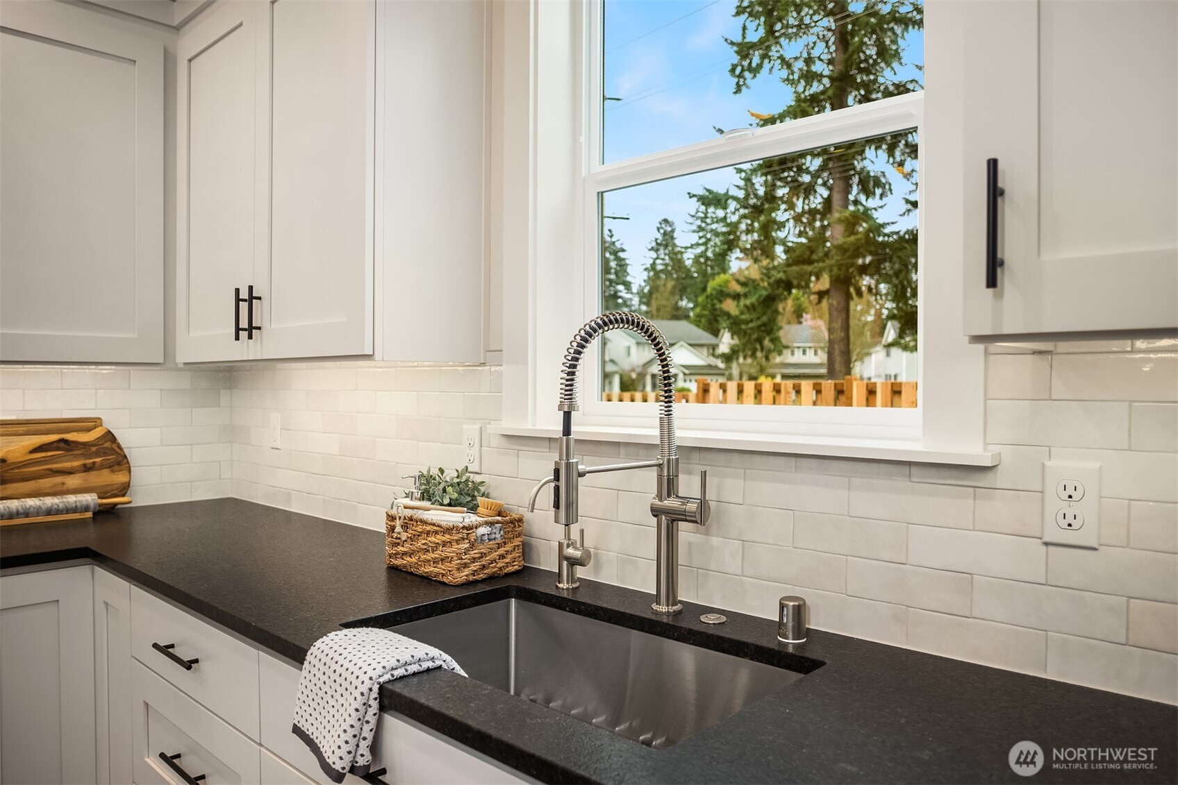 9207 Northeast 175th Street, Unit A Bothell, WA 98011 - Photo 9 of 38 a kitchen with a sink cabinets and a window