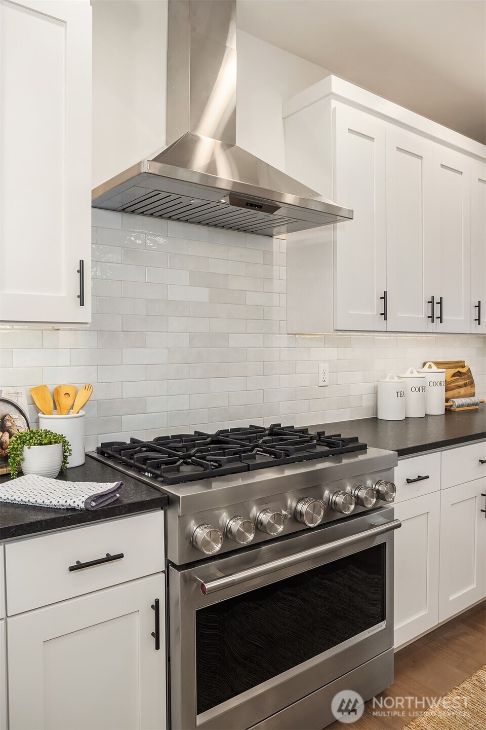 9207 Northeast 175th Street, Unit A Bothell, WA 98011 - Photo 10 of 38 a stove top oven sitting inside of a kitchen