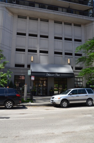 33 West Delaware Place, Unit 13A Chicago, IL 60610 - Photo 1 of 10 a view of a car parked in front of a building