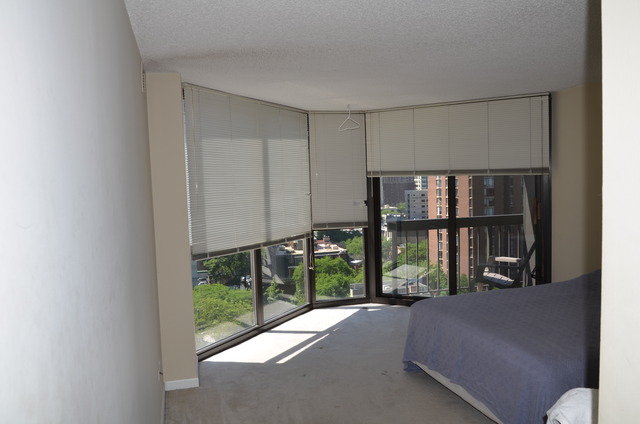 33 West Delaware Place, Unit 13A Chicago, IL 60610 - Photo 9 of 10 a living room with furniture and a large window
