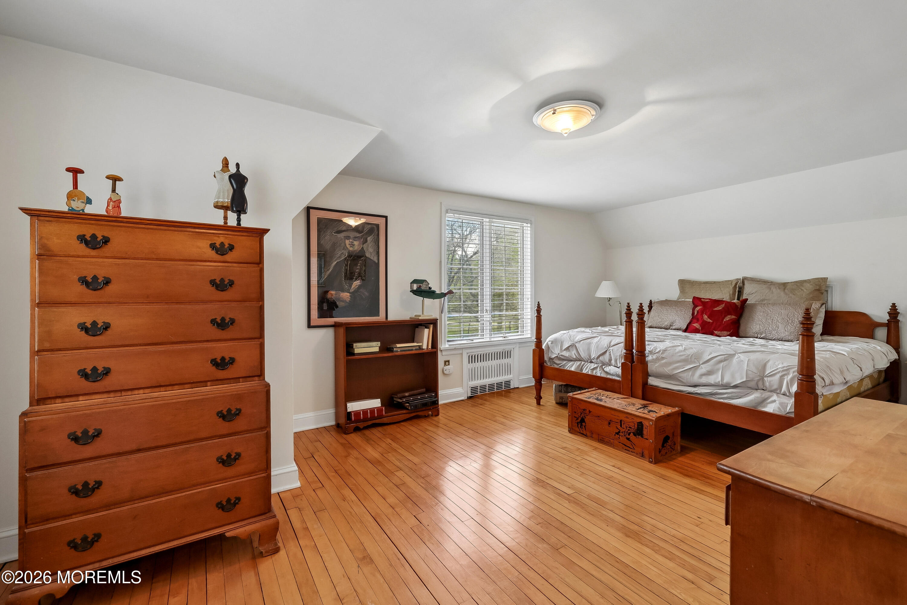 187 Hockhockson Road Colts Neck, NJ 07722 - Photo 38 of 55 a bedroom with furniture and wooden floor