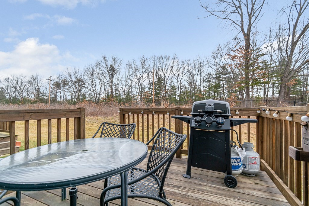 69 Riley Road, Unit 69 Tyngsboro, MA 01879 - Photo 12 of 42 a view of a chairs and table on the roof deck