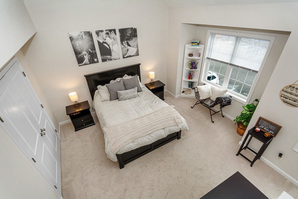 69 Riley Road, Unit 69 Tyngsboro, MA 01879 - Photo 22 of 42 a bedroom with a bed furniture and window
