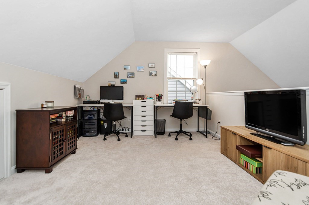 69 Riley Road, Unit 69 Tyngsboro, MA 01879 - Photo 23 of 42 a view of a livingroom with workspace and a window