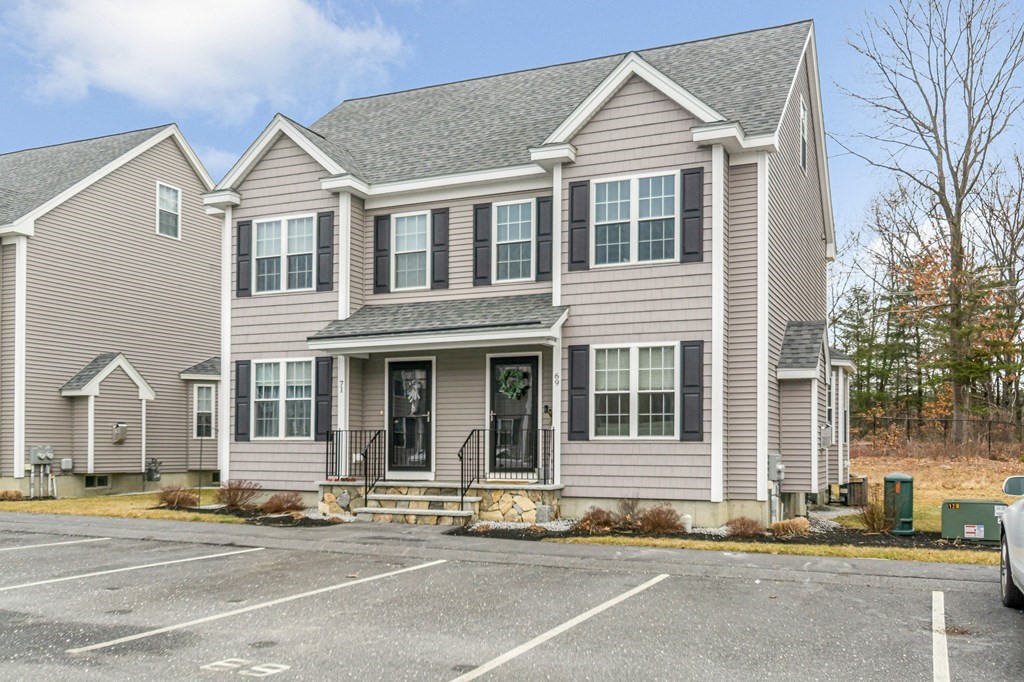 69 Riley Road, Unit 69 Tyngsboro, MA 01879 - Photo 30 of 42 a view of a house with a outdoor space