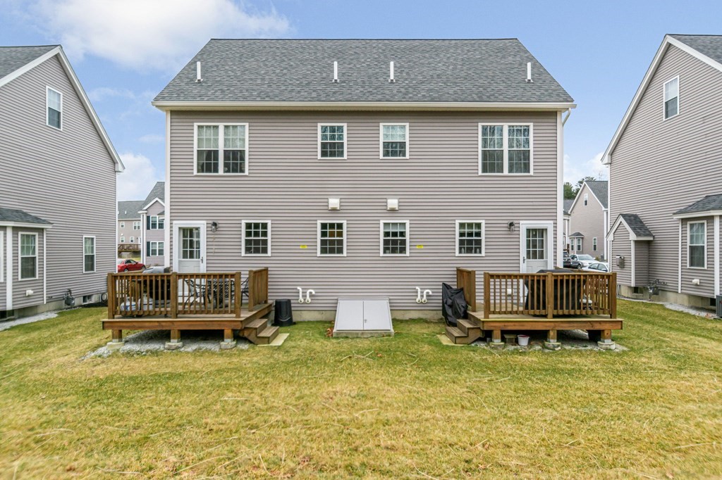 69 Riley Road, Unit 69 Tyngsboro, MA 01879 - Photo 34 of 42 a view of a house with swimming pool next to a yard