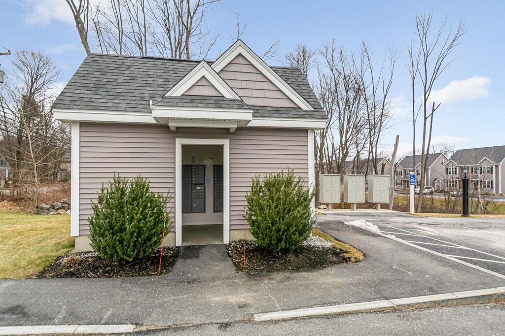 69 Riley Road, Unit 69 Tyngsboro, MA 01879 - Photo 35 of 42 a front view of a house with garden