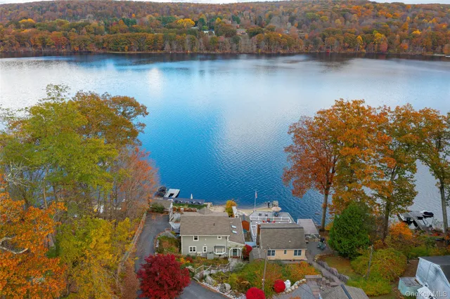 an aerial view of a house with a lake view