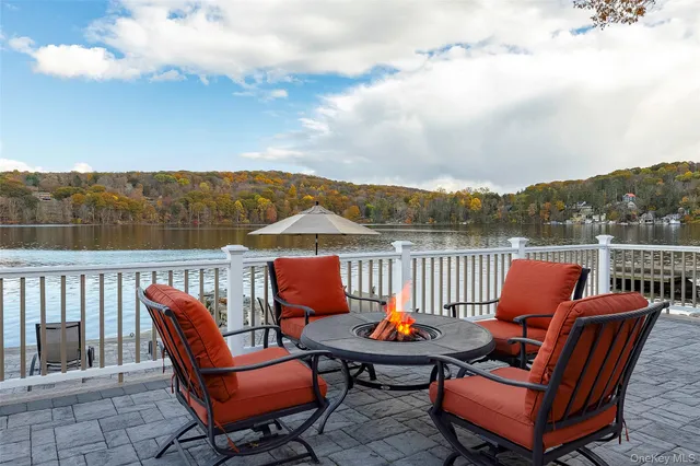 a balcony with wooden floor and fence