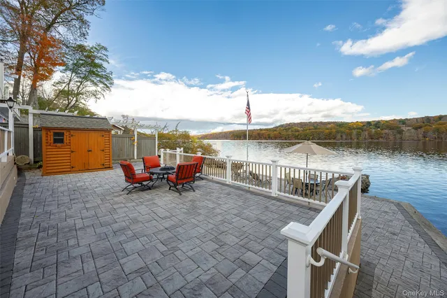 a view of a chair and tables on the roof deck