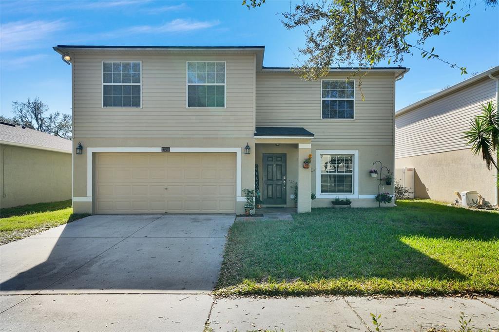 front view of a house with a yard