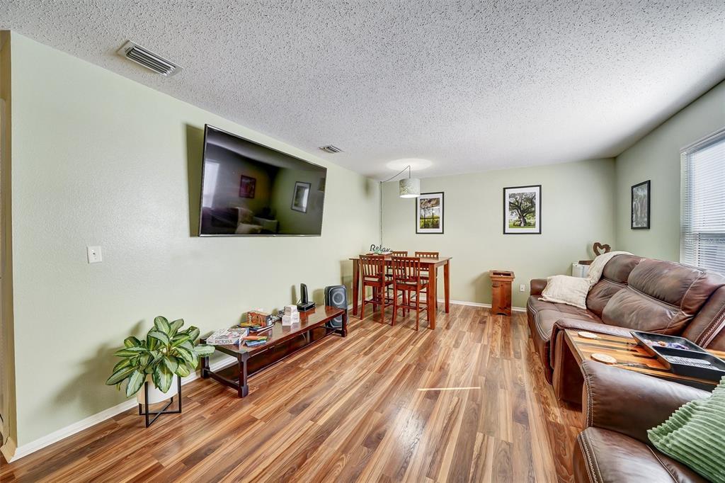 13706 Fareham Road Odessa, FL 33556 - Photo 11 of 21 a living room with furniture and wooden floor