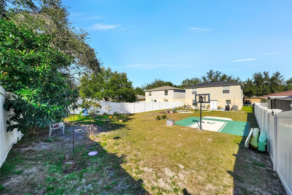 13706 Fareham Road Odessa, FL 33556 - Photo 21 of 21 a swimming pool with some tall trees