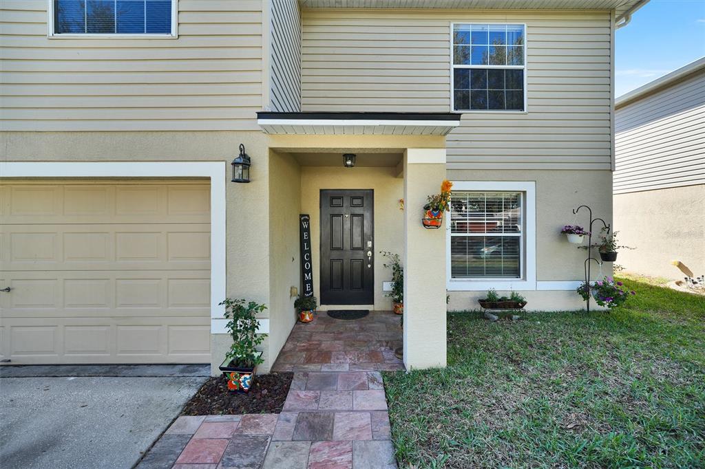 13706 Fareham Road Odessa, FL 33556 - Photo 3 of 21 a front view of a house with a yard