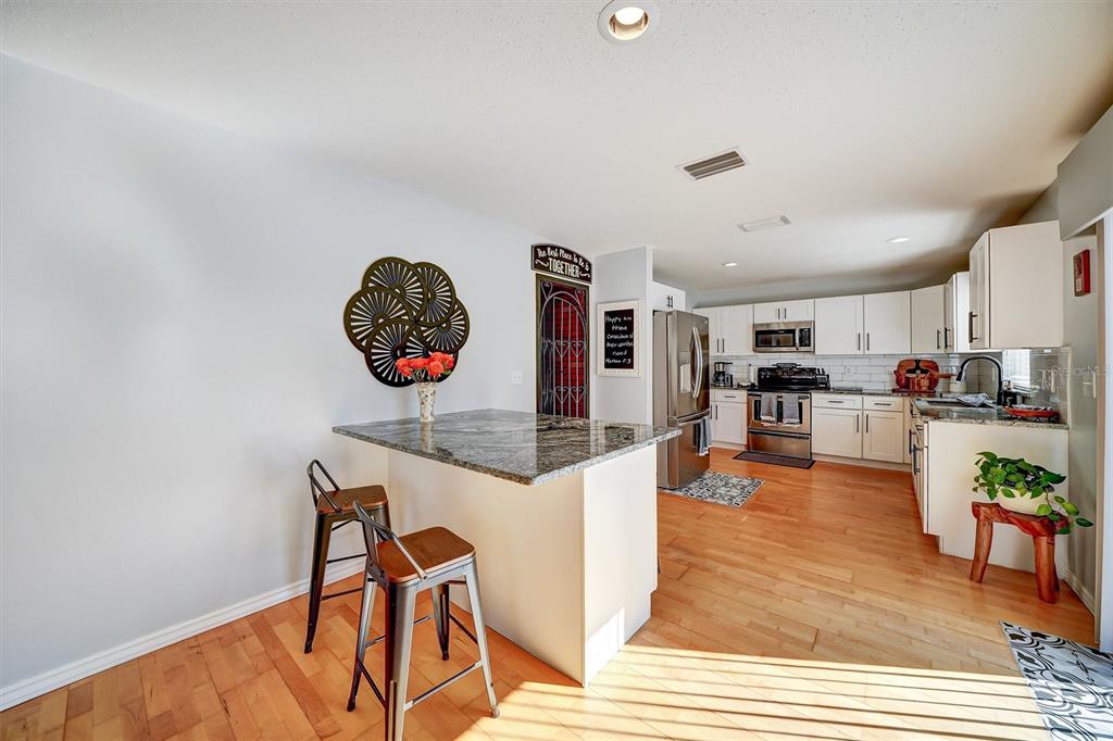 13706 Fareham Road Odessa, FL 33556 - Photo 6 of 21 a living room with furniture a rug and a table