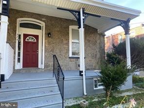 a front view of a house with a porch