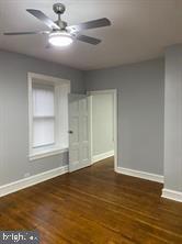 329 East Walnut Lane, Unit 2 Philadelphia, PA 19144 - Photo 6 of 8 a view of empty room with wooden floor and fan