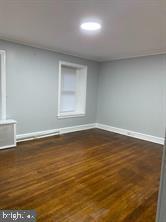 329 East Walnut Lane, Unit 2 Philadelphia, PA 19144 - Photo 7 of 8 a view of a room with wooden floor and windows