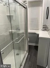 a bathroom with a sink and a shower