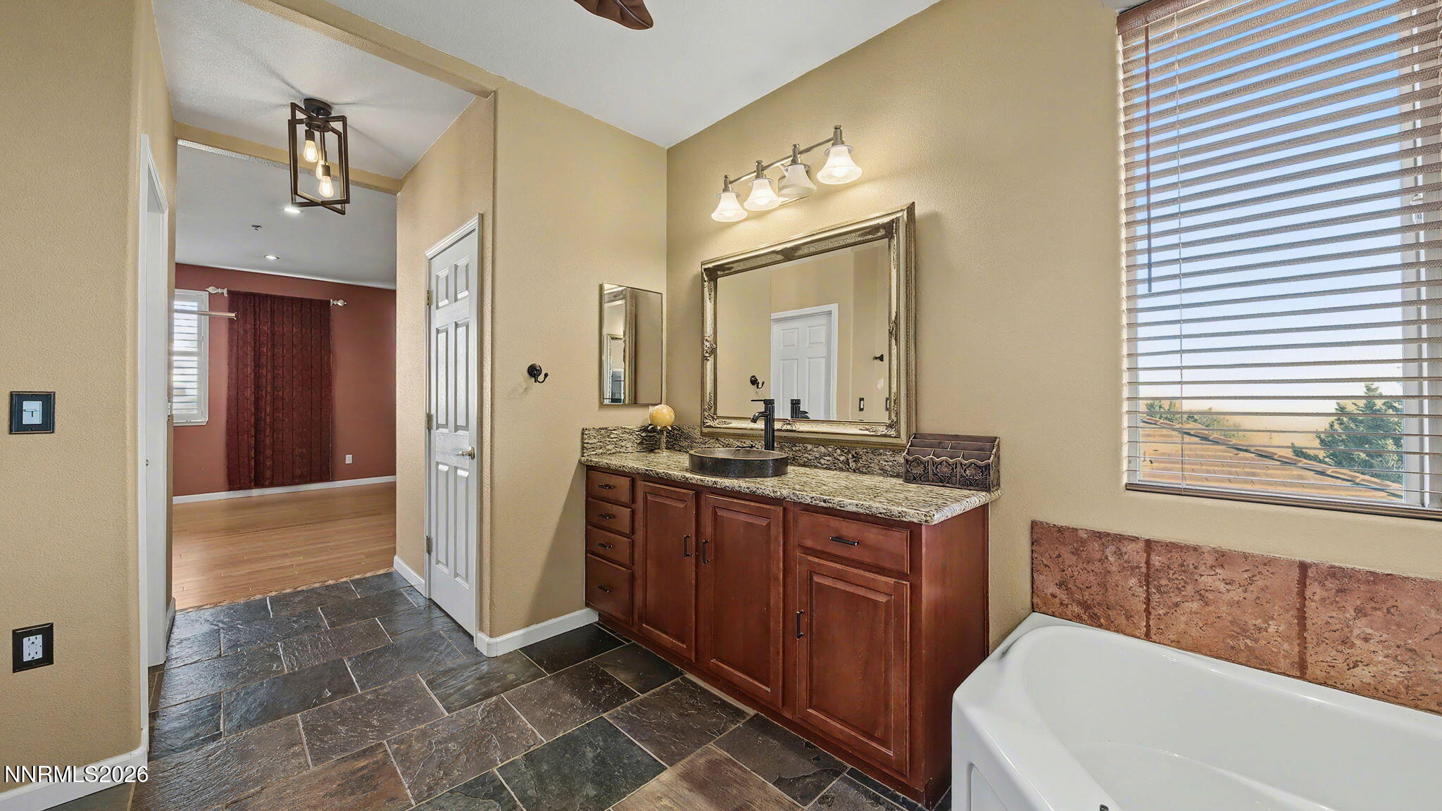 3250 Cityview Terrace Sparks, NV 89431 - Photo 26 of 62 a bathroom with a granite countertop sink and a mirror