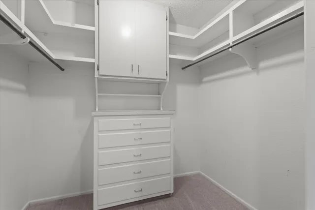 a view of an empty walk in closet