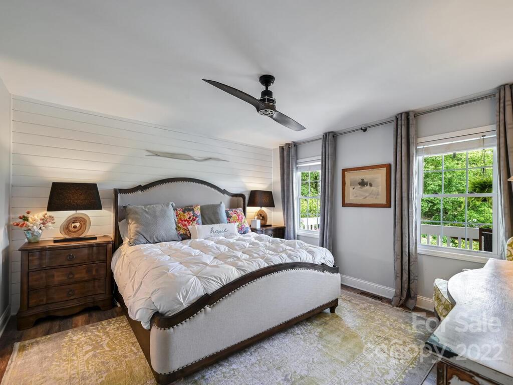 15 Raccoon Point, Unit 7 Canton, NC 28716 - Photo 17 of 39 a bedroom with a bed and wooden floor