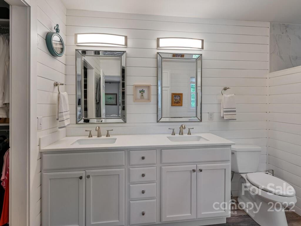 15 Raccoon Point, Unit 7 Canton, NC 28716 - Photo 19 of 39 a bathroom with a toilet sink and mirror
