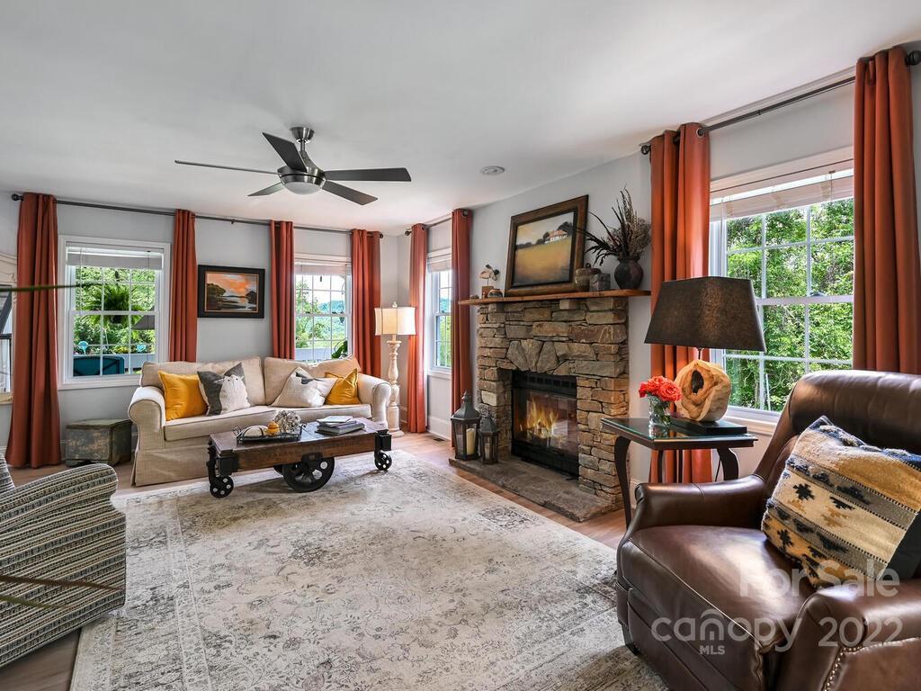 15 Raccoon Point, Unit 7 Canton, NC 28716 - Photo 6 of 39 a living room with furniture fireplace and a large window