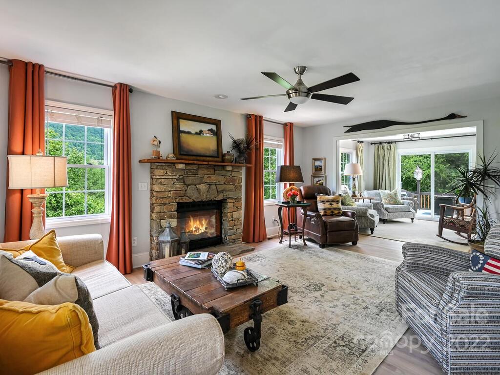 15 Raccoon Point, Unit 7 Canton, NC 28716 - Photo 7 of 39 a living room with furniture fireplace and a large window