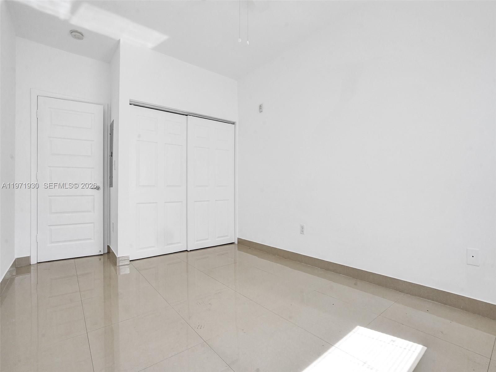 540 74th Street, Unit 10 Miami Beach, FL 33141 - Photo 11 of 27 an empty room with closet