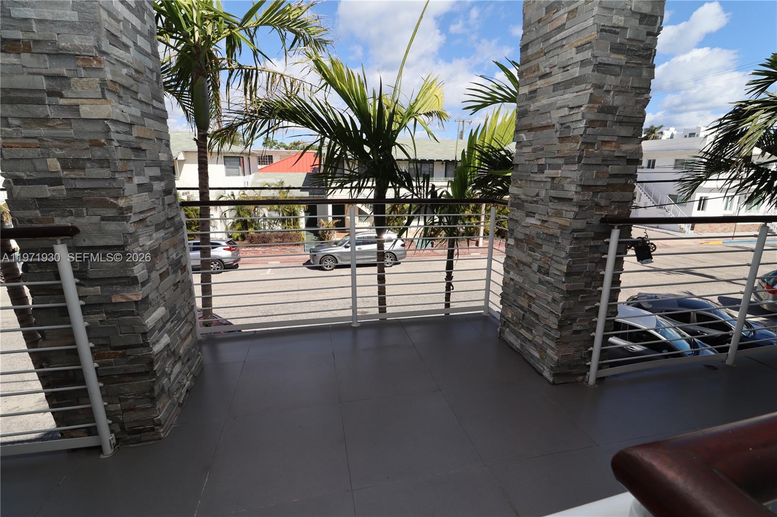 540 74th Street, Unit 10 Miami Beach, FL 33141 - Photo 20 of 27 a view of entryway with wooden floor