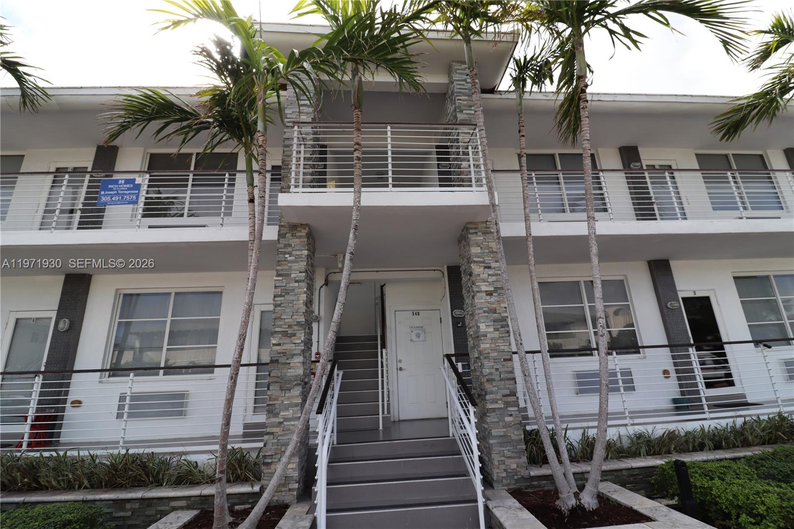 540 74th Street, Unit 10 Miami Beach, FL 33141 - Photo 23 of 27 front view of a house with a door