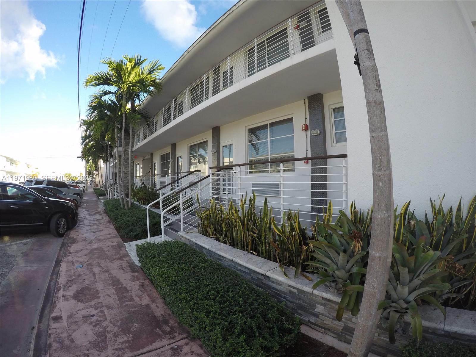 540 74th Street, Unit 10 Miami Beach, FL 33141 - Photo 26 of 27 a view of a house with a yard