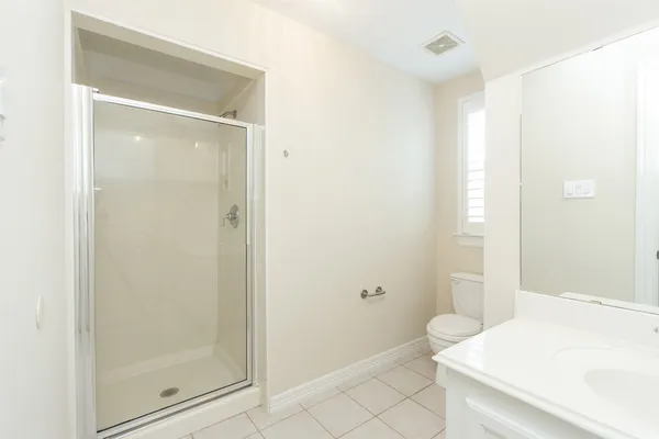 a bathroom with a shower and a toilet
