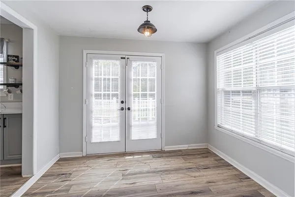 a view of an empty room with a window