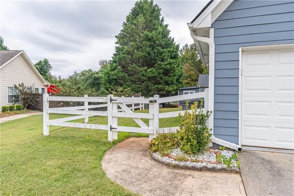 a house with garden in front of it