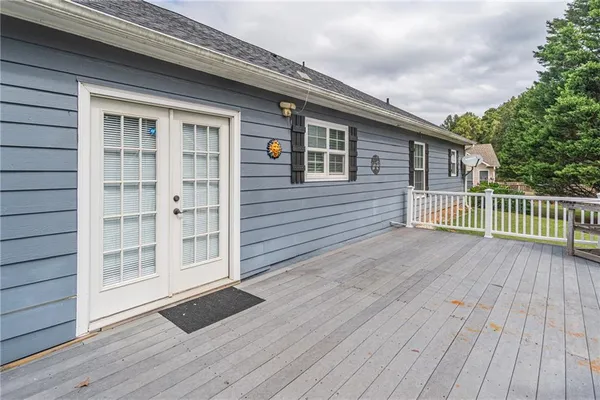a view of a house with a yard patio and sitting area