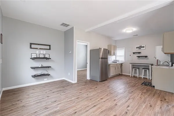 a view of a kitchen with a stove cabinets and wooden floor
