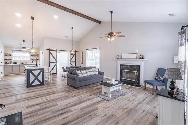 a living room with furniture and a fireplace