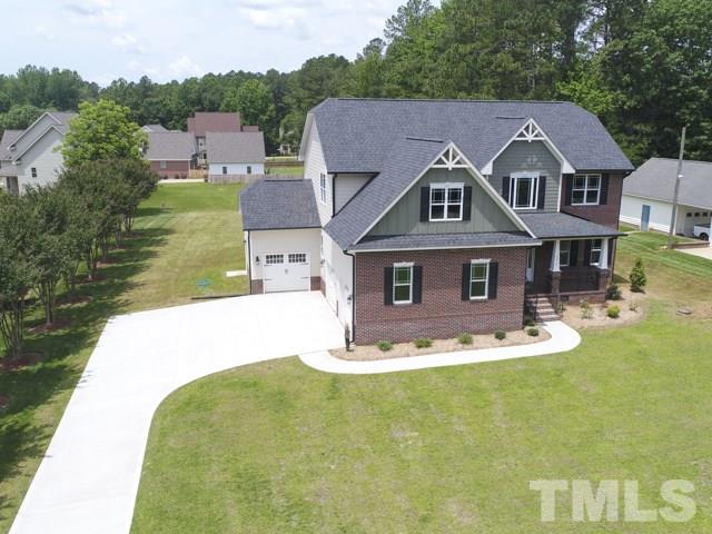 9814 Chris Drive Raleigh, NC 27603 - Photo 2 of 25 a aerial view of a house with a yard table and chairs
