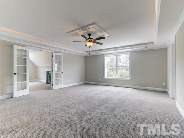 9814 Chris Drive Raleigh, NC 27603 - Photo 12 of 25 a view of a livingroom with a ceiling fan and window