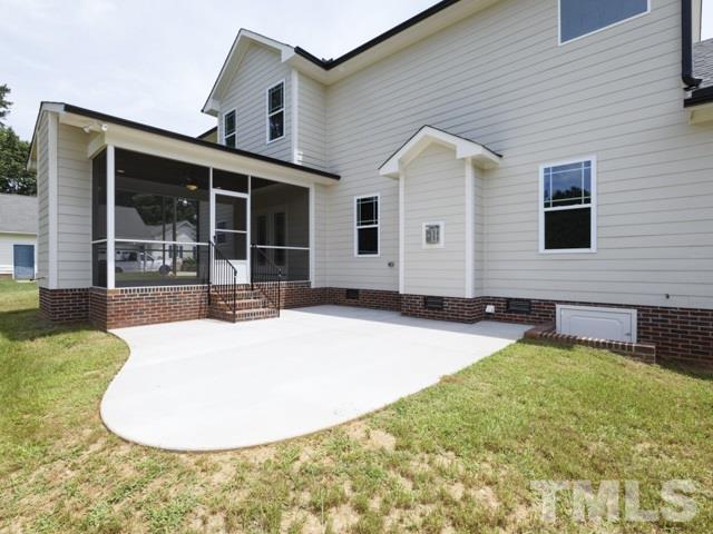 9814 Chris Drive Raleigh, NC 27603 - Photo 23 of 25 a front view of a house with yard