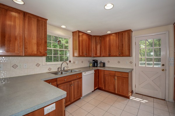 201 Davidson Road Boxborough, MA 01719 - Photo 5 of 30 a kitchen with a sink window and cabinets