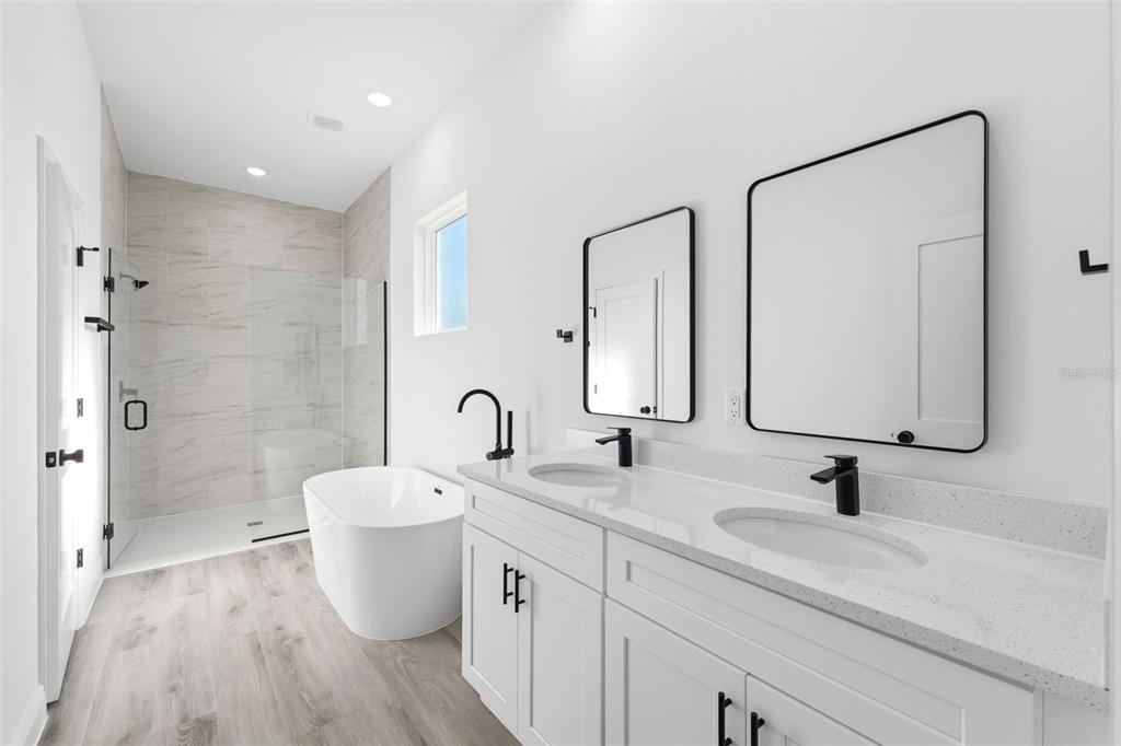 4510 Southwest 155th Street Ocala, FL 34473 - Photo 22 of 40 a bathroom with a double vanity sink and a mirror