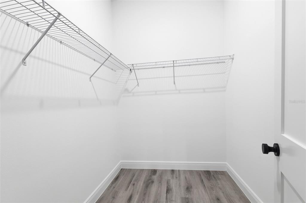 4510 Southwest 155th Street Ocala, FL 34473 - Photo 24 of 40 a view of a room with racks on the wall