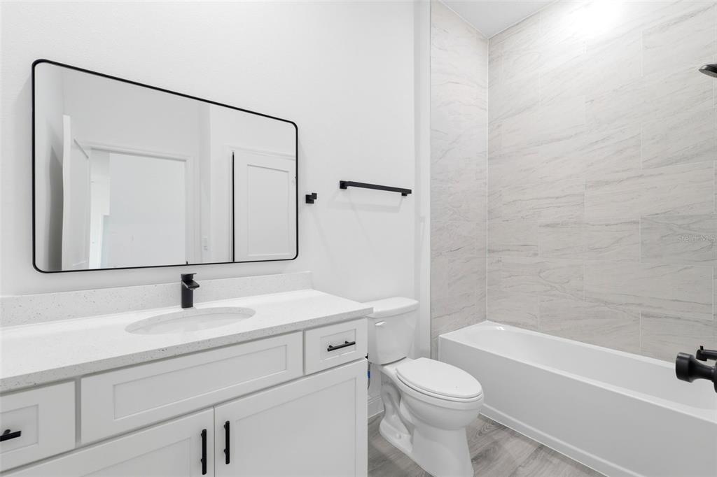 4510 Southwest 155th Street Ocala, FL 34473 - Photo 27 of 40 a bathroom with a sink toilet and shower