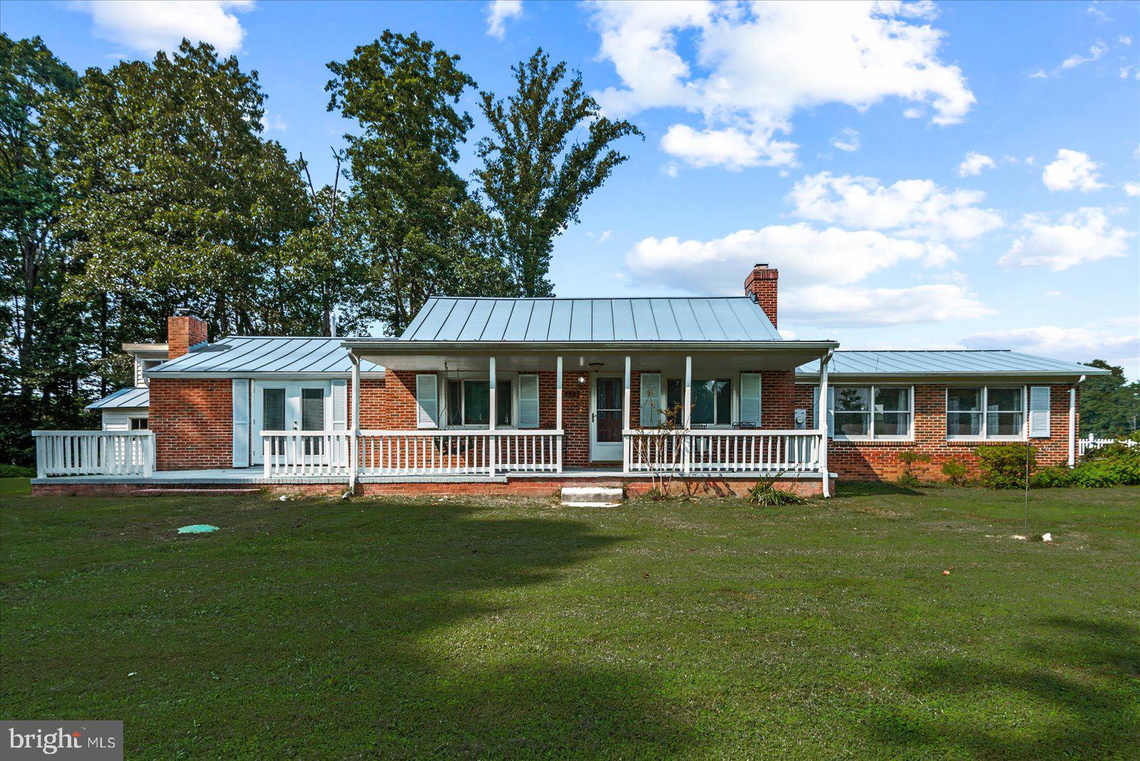 2931 Vawter Corner Road Louisa, VA 23093 - Photo 1 of 47 a front view of a house with a garden