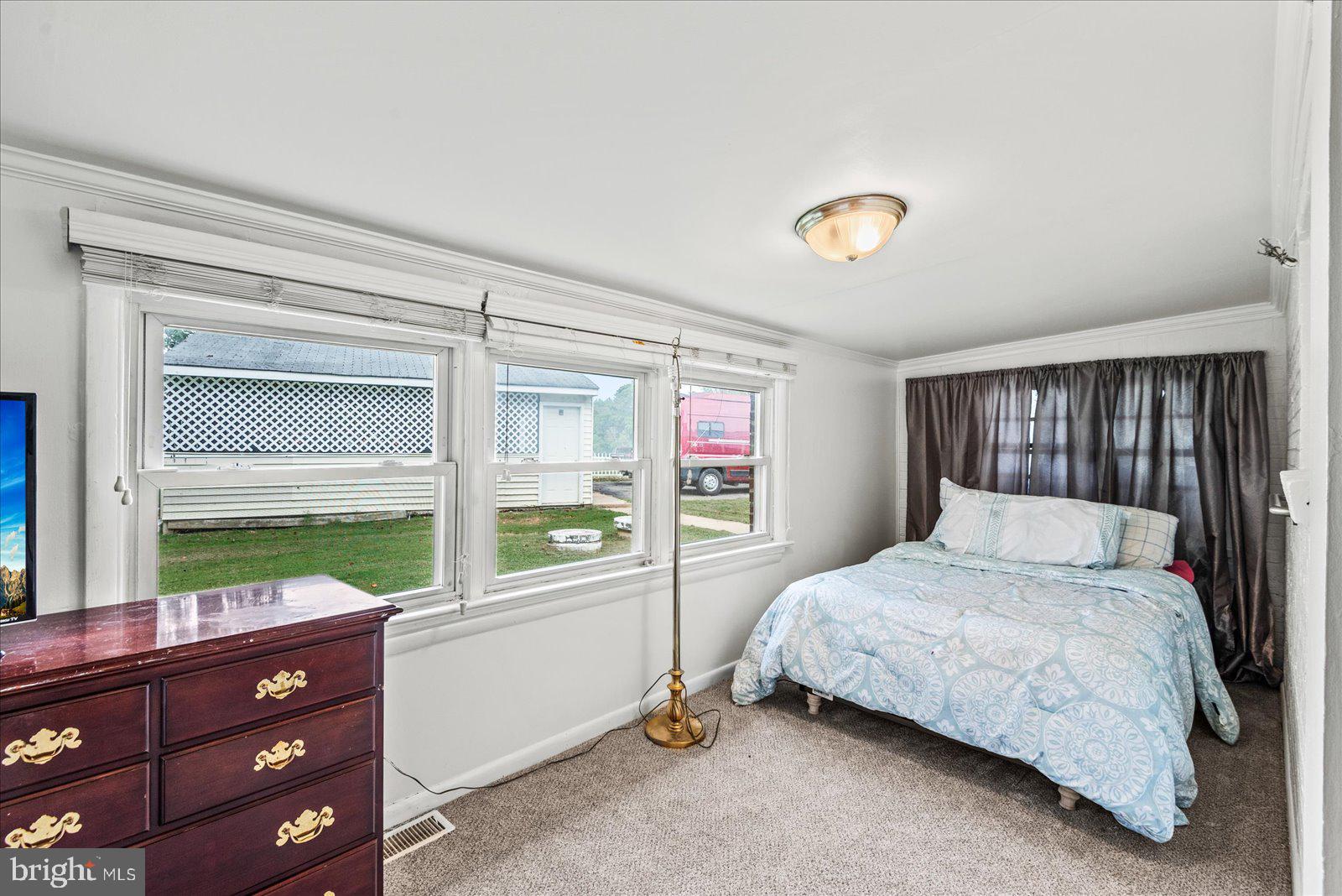 2931 Vawter Corner Road Louisa, VA 23093 - Photo 19 of 47 a bedroom with a bed and a window