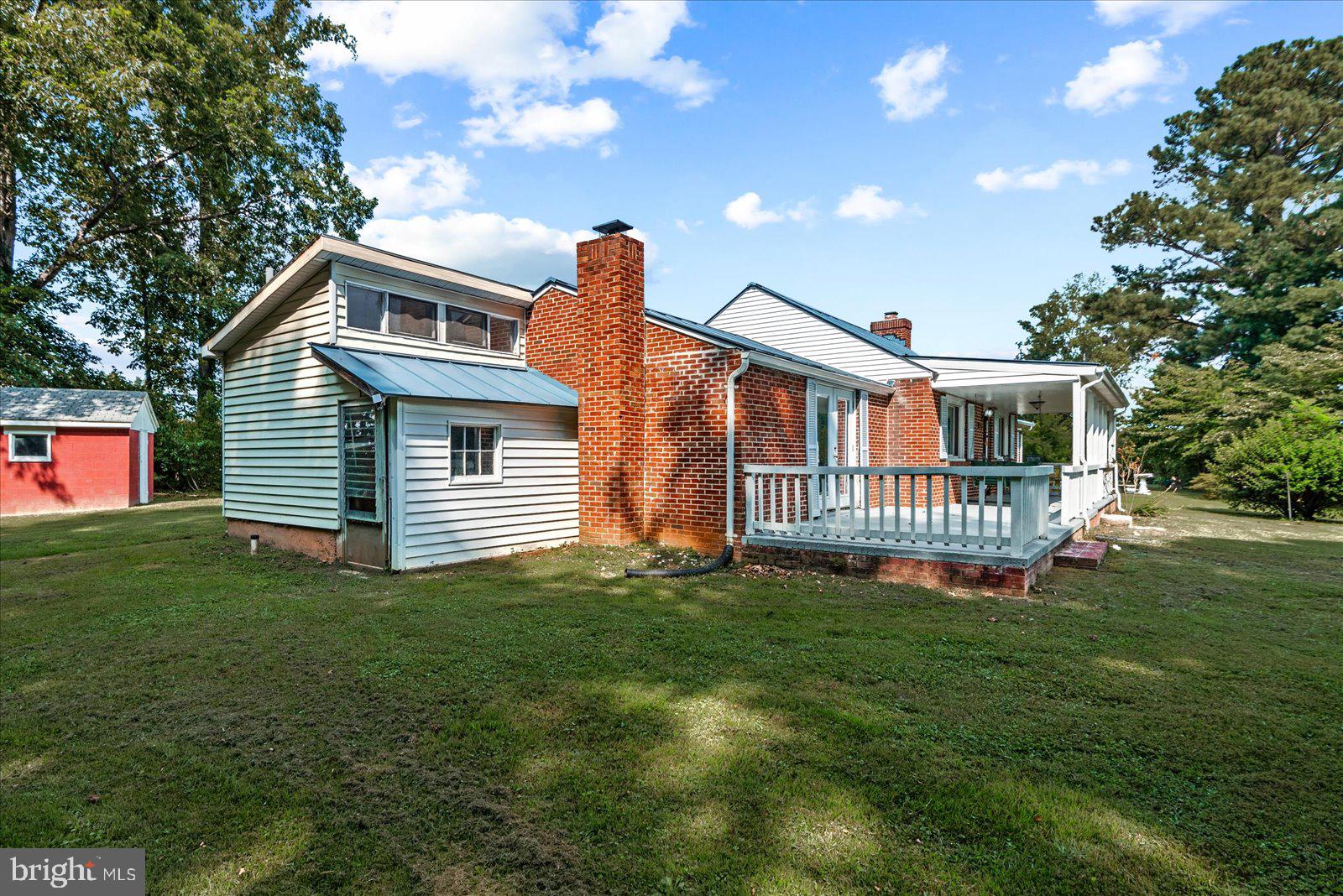 2931 Vawter Corner Road Louisa, VA 23093 - Photo 2 of 47 a view of a house with a yard and a porch
