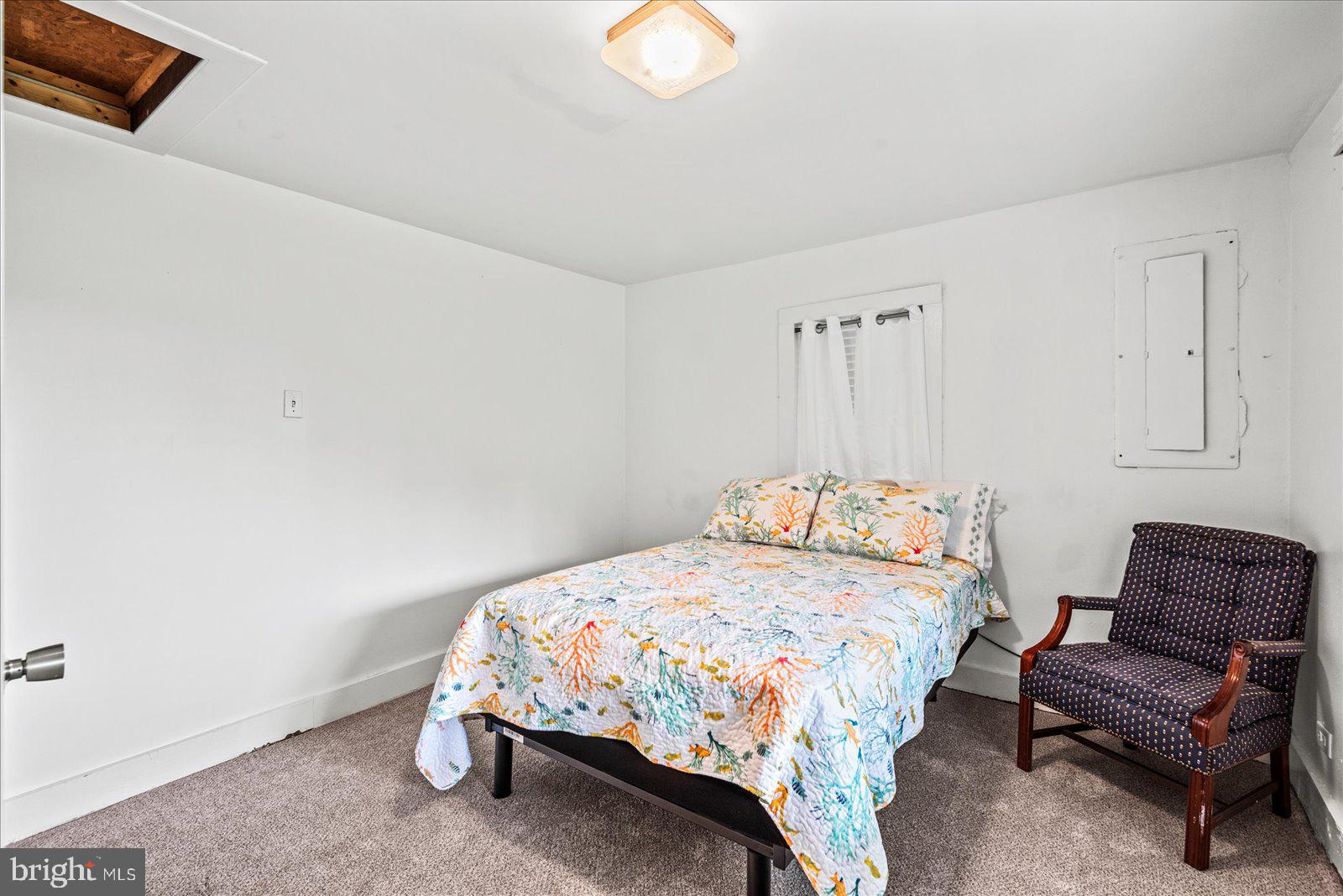 2931 Vawter Corner Road Louisa, VA 23093 - Photo 24 of 47 a bedroom with a bed and a couch
